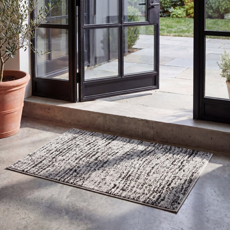 Riebe Abstract Black/Silver Area Rug