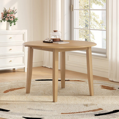 Table de salle à manger ronde extensible (table seule, sans chaises, plateau et pieds inclus) en MDF et bois d'hévéa. Style moderne et gain d'espace pour les petites cuisines.