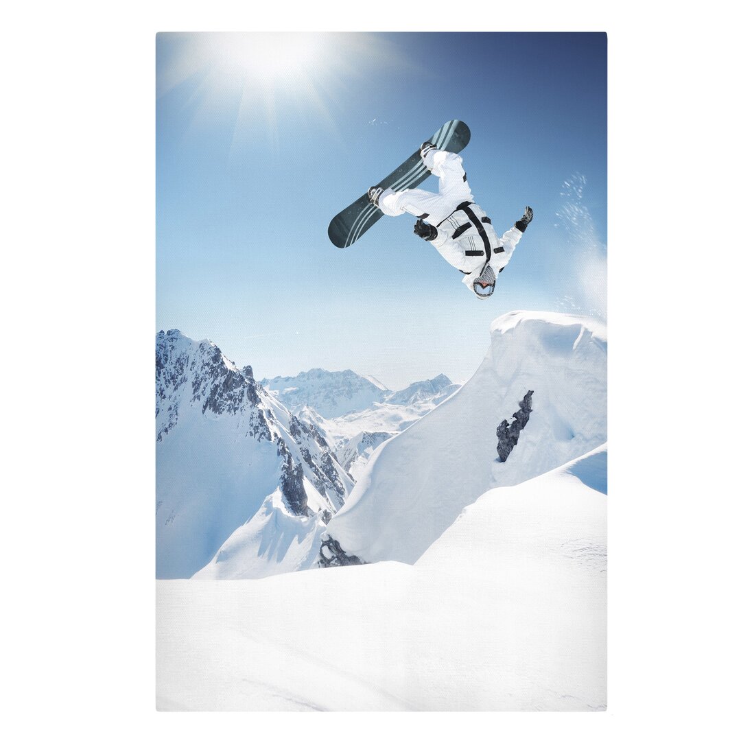 Leinwandbild Fliegender Snowboarder