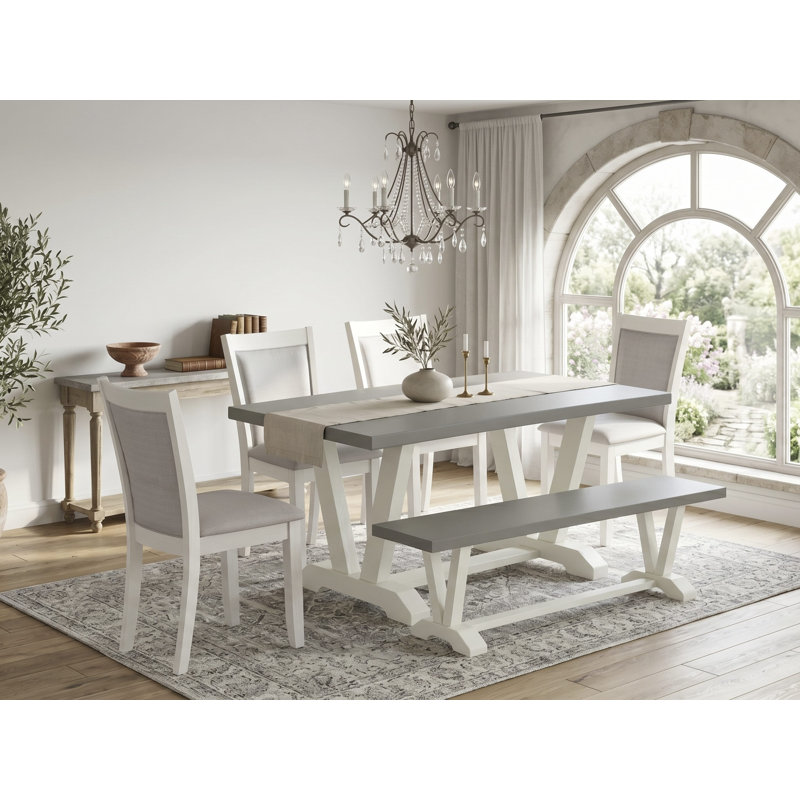 L'ensemble de table à manger de 6 pièces comprend une table rectangulaire en ciment, un banc en bois et 4 chaises rembourrées en tissu de lin crème avec un haut dossier en lin brossé blanc.