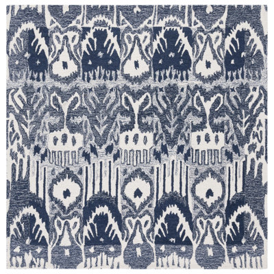 Tapis ivoire / bleu en laine / coton touffeté à la main Ikat