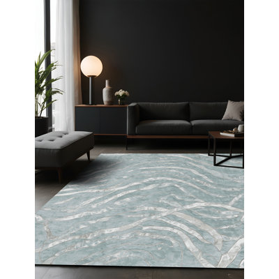 Tapis bleu soyeux et moelleux