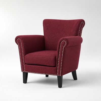Fauteuil club rembourré élégamment courbé avec garniture cloutée appliquée à la main et pied en bois de bouleau durable
