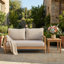 Causeuse de patio en bois d'acacia avec coussin beige résistant à l'eau