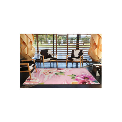 Tapis floral lavable à base tissée rose