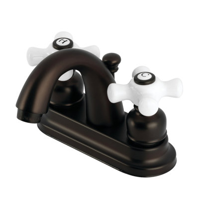 Kingston Brass Restoration Two-Handle 3-Hole Deck Mount 4" Centerset Bathroom Faucet with Plastic Pop-Up