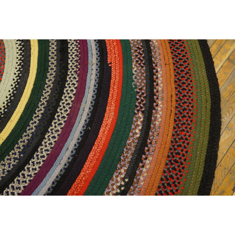 Tapis rond tressé antique à motif circulaire