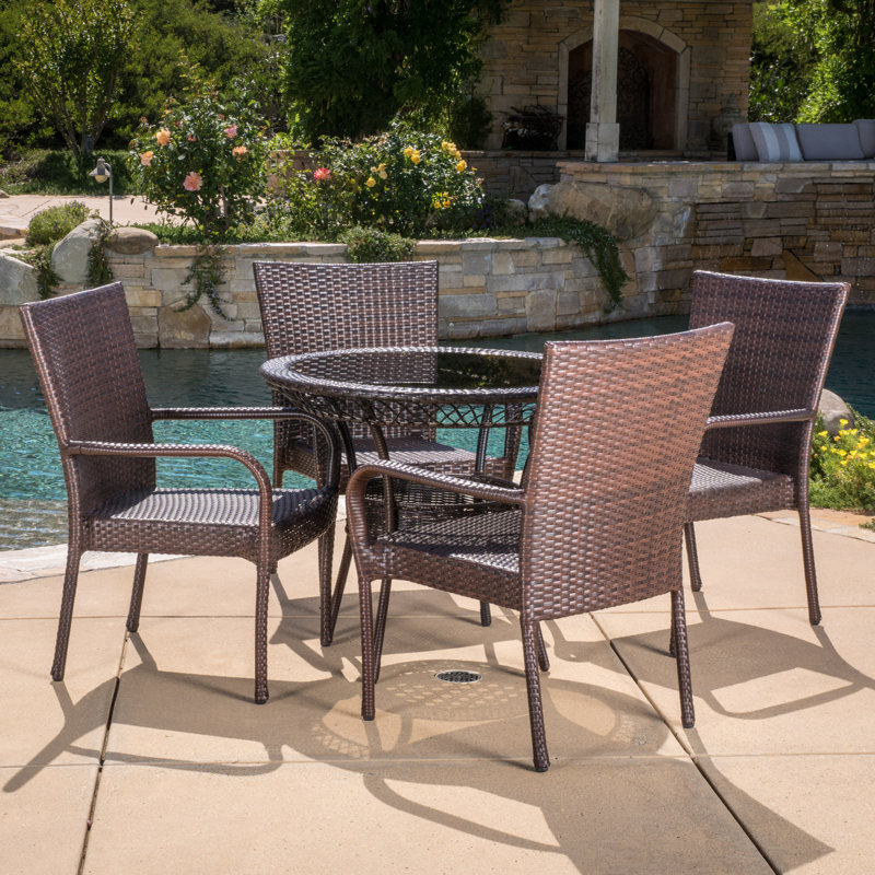 Donato 4 - Person Wicker Patio Dining Set with Round Table