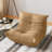 Beige tufted floor lounge chair with a low-profile, contoured design.