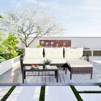 Ensemble de conversation pour patio 3 pièces: canapé modulaire avec coussins beiges et table basse moderne 3 places - 2 places