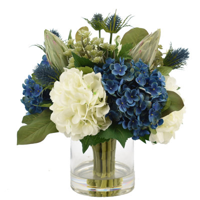 Assorted Hydrangeas with Thistle, Cactus and Protea in Glass Vase