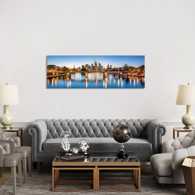 Frankfurt Central Business District And Ignatz-Bubis-Brücke (Ignatz Bubis Bridge) At Night, Hesse, Germany by Jan Becke - Wrapped Canvas Panoramic Print