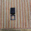 Wasif Area Rug in Brown