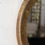 Miroir mural rond de 31,3 pouces texturé doré avec cadre en fer et dossier en panneau de fibres à densité moyenne, décor bohème parfait pour le salon ou la chambre à coucher