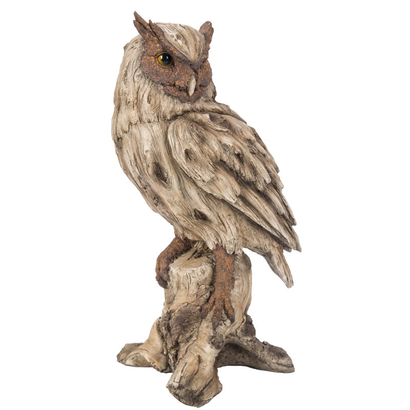 Statue aigle en bois flotté sur souche