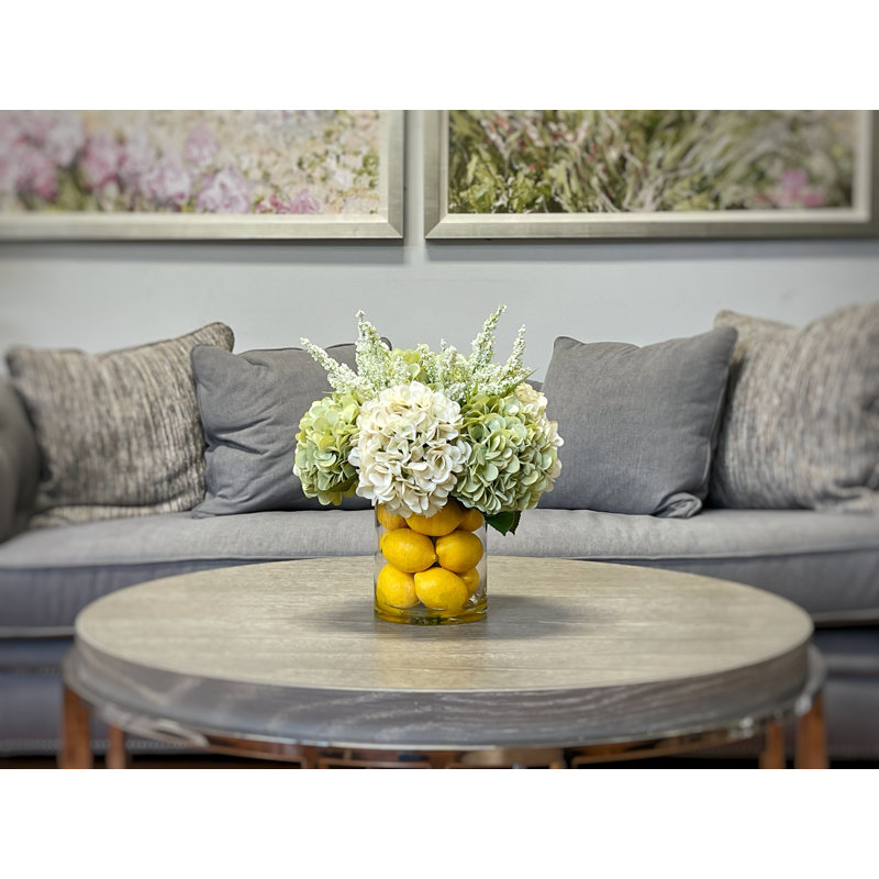 Hydrangeas Arranged in Glass Vase with Lemons