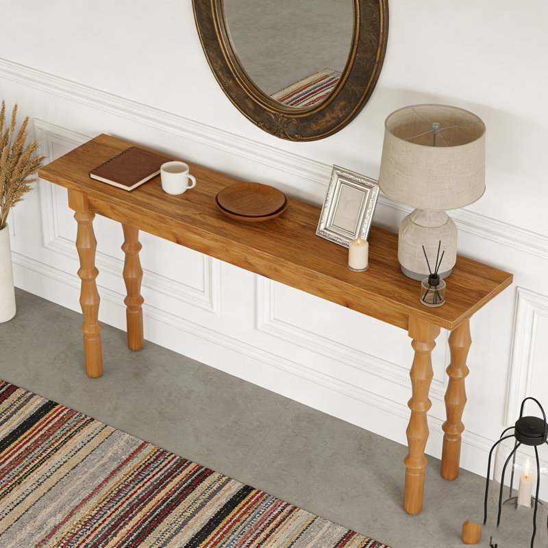 Console en bois avec canapé et table derrière le canapé