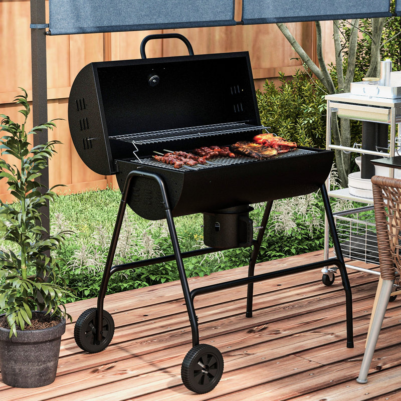 Barbecue au charbon de bois de 420 po² avec roulettes pratiques. Parfait pour la cuisine en plein air, les pique-niques sur la terrasse et les fêtes dans le jardin. Comprend un thermomètre intégré, un récupérateur de cendres et une surface de cuisson munie de roulettes.