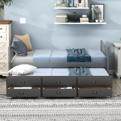 Lit de jour simple gris avec couchette et tiroirs pour un dortoir élégant
