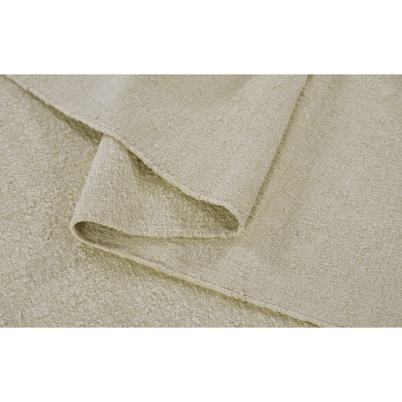 Koukila Ivory Solid Handwoven Wool 6' x 9' Area Rug