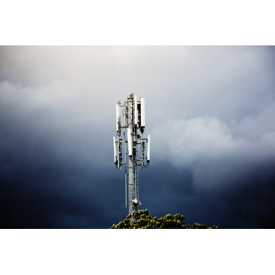 Cellphone Base Station Mast Against Stormy Sky by RapidEye - No Frame Art Prints on Canvas
