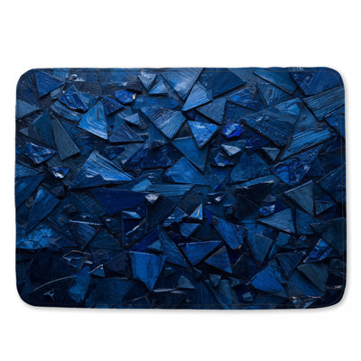 Tapis de bain bleu à formes triangulaires