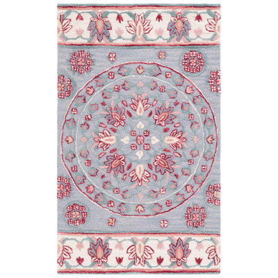 Crusita Hand Tufted Wool Floral Rug