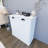 White Double Compartment Tilted Laundry Sorting Cabinet