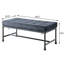 Banc de chambre en velours gris avec pieds industriels et design industriel capitonné pour