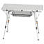 Table de pique-nique extérieure en aluminium argenté, pliable et à hauteur réglable, avec un plateau en maille de 90 cm de large, une structure en acier sans soudure pour une stabilité optimale, et un format compact et enroulable pour un rangement facile dans un garage.
