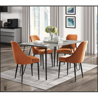 Ensemble de salle à manger moderne et élégant 5 pièces avec chaises en velours orange et structure en métal pour un repas élégant et confortable