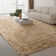 Blakes Solid Color Handmade Faux Sheepskin Area Rug in Beige