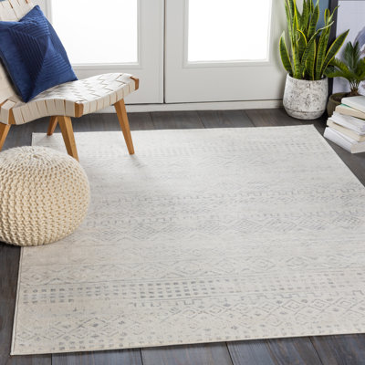 Tapis gris et ivoire tissé au métier mécanique Turney