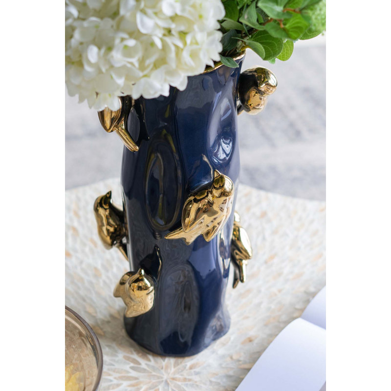 Vase en céramique avec branches d'oiseaux