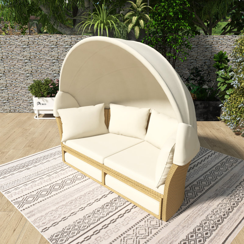 Lit de jour rond en rotin pour l'extérieur avec auvent rétractable et coussins amovibles