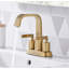 Robinet de salle de bain central à deux poignées avec drain Dayani - Or brossé-58635880