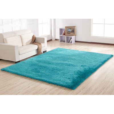 Tapis turquoise à poils longs touffeté à la main Huya