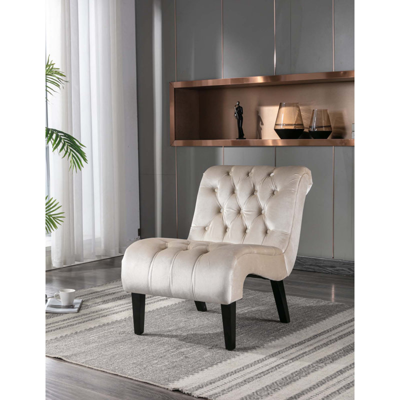 Fauteuil d'appoint sans accoudoirs en velours avec capitonnage et pieds en bois robustes
