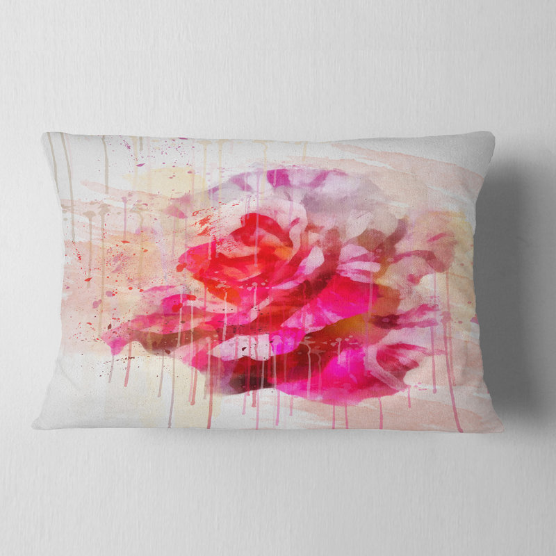 Coussin lombaire floral rose avec des éclaboussures d’aquarelle
