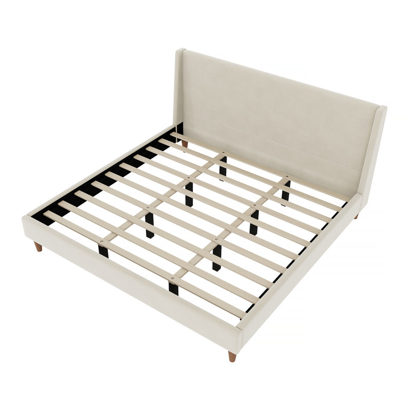 Lit plateforme tapissier avec une superbe tête de lit à oreilles et des pieds ronds en bois massif pour une chambre à coucher confortable et élégante