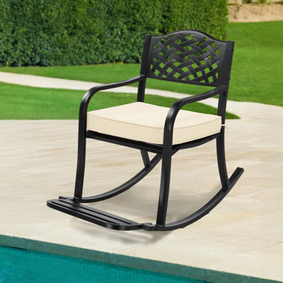 Black Iron Rocking Chair With Floral Backrest And Off-White Cushion
