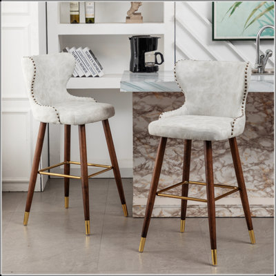 Nevis Mid-century Modern Faux Leather Tufted Nailhead Trim Barstool Set of 2
