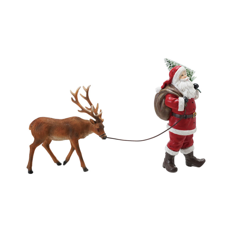 Résine père Noël menant un renne