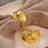 Gold Napkin Rings Set of 4 Stylized Overlapping Leaf Design for Elegant Dining Table Decor