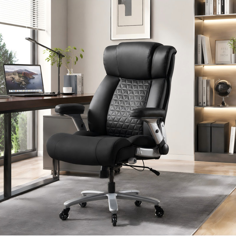 Heavy-duty, extra-thick executive office chair; 500 lb weight capacity; adjustable lumbar support; extra-wide seat; flip-up armrests; silent rubber casters.
