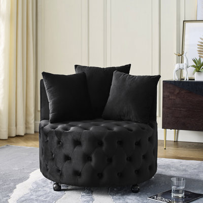 Fauteuil pivotant en velours noir moderne avec boutons et roulettes pour une expérience confortable. Capitonnage, roues et salon de couleur noire