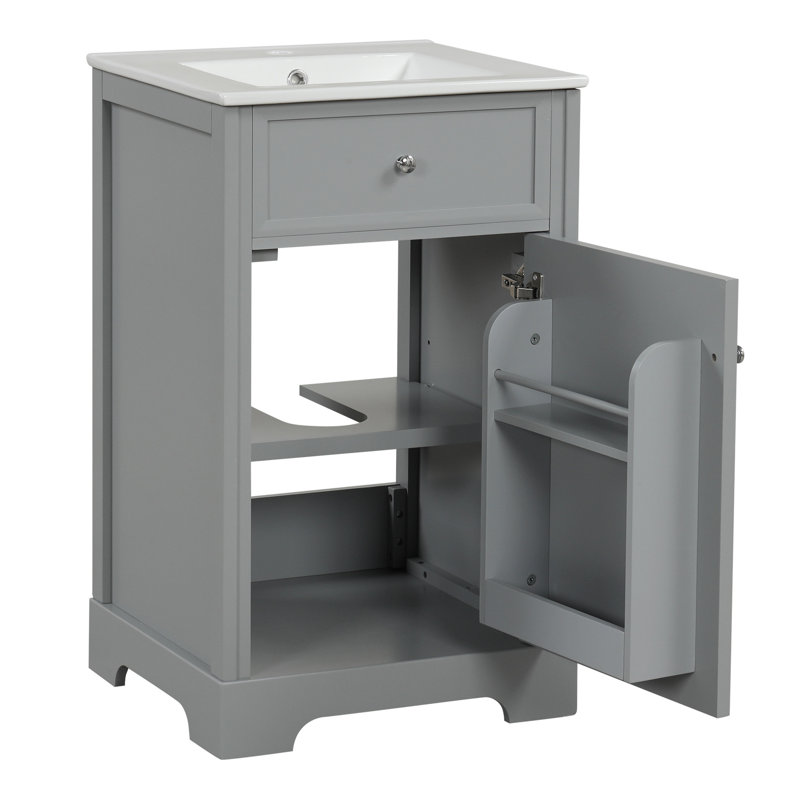Meuble-lavabo de salle de bain de 50 cm (20 po) de couleur grise, avec un seul lavabo et une poignée de porte ronde. Style moderne avec lavabo en céramique blanche et grand espace de rangement pour une salle de bain bien rangée.