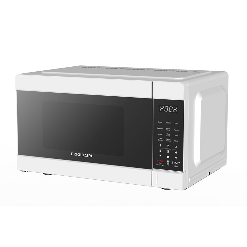 Frigidaire Pi. Four à micro-ondes de comptoir, 900 watts avec 10 niveaux de puissance, blanc, Blanc
