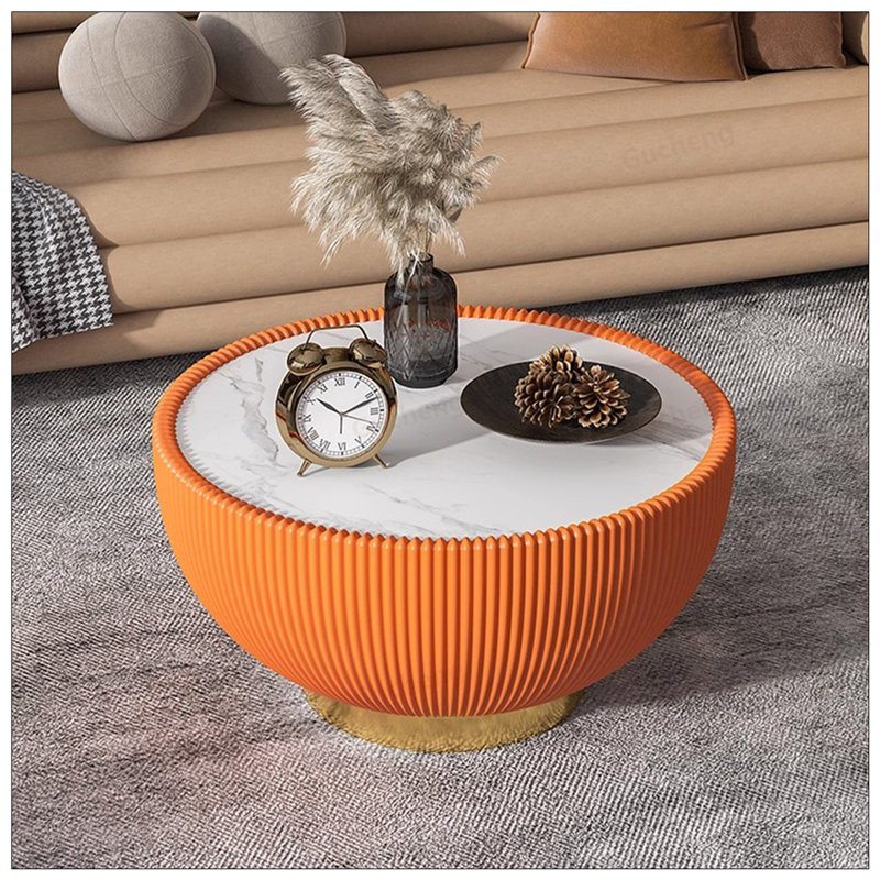 Table basse luxueuse en cuir avec plateau en marbre clair, design rond moderne pour un mobilier de salon élégant, Orange