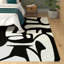 Tapis blanc / noir à motif abstrait Rivero-519294918